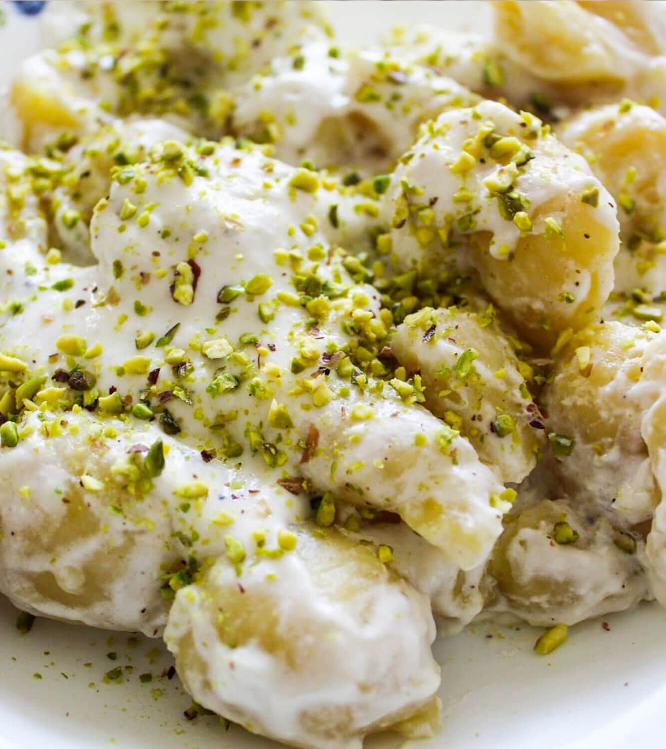 Gnocchi stuffed with Gorgonzola PDO with Philadelphia and Parmesan cream and pistachio granules