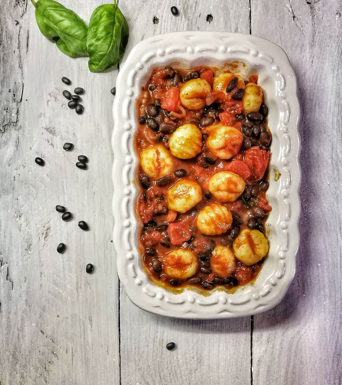 Vegan gnocchi with black bean ragu