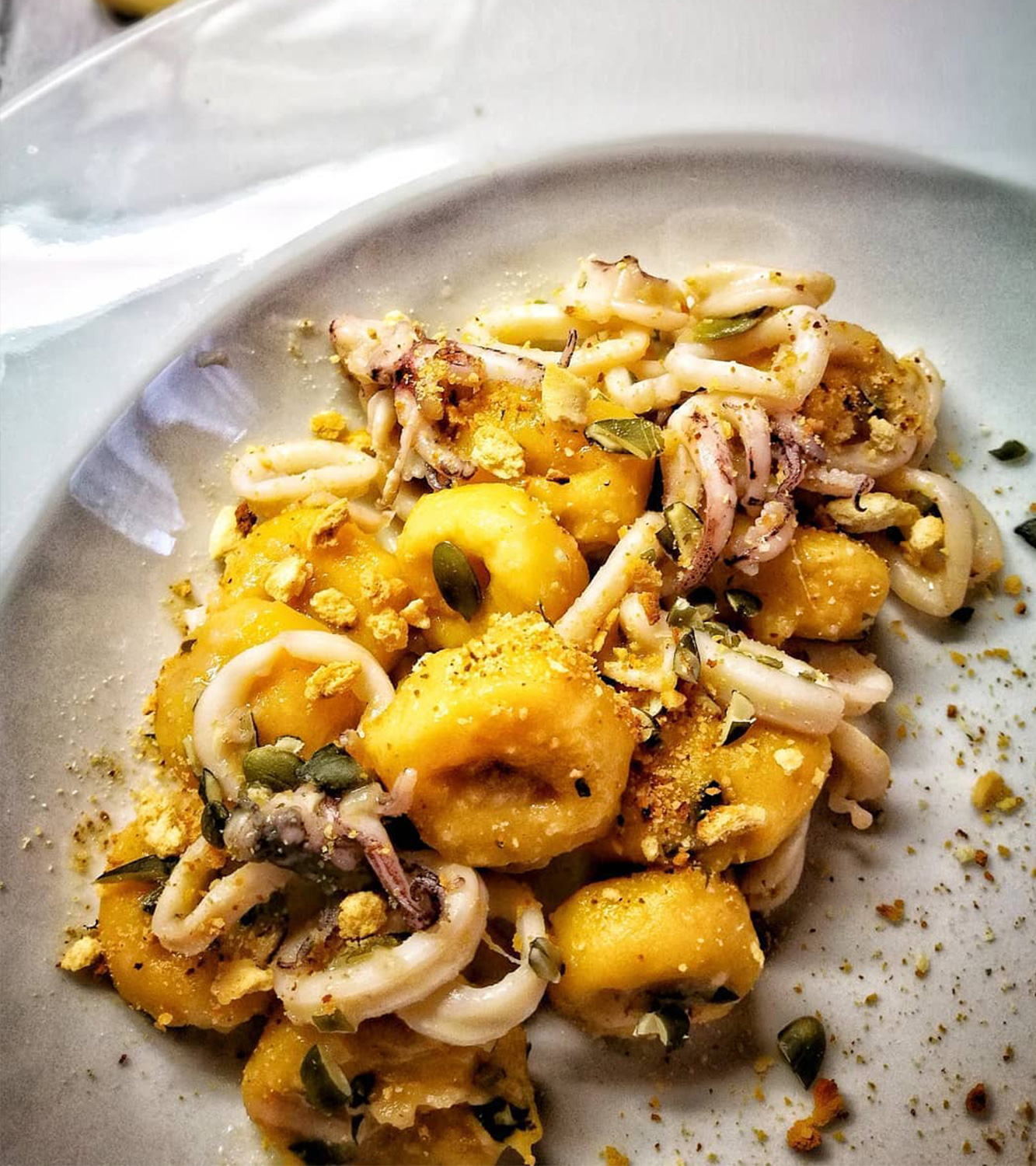 Potato gnocchi with pumpkin with calamari