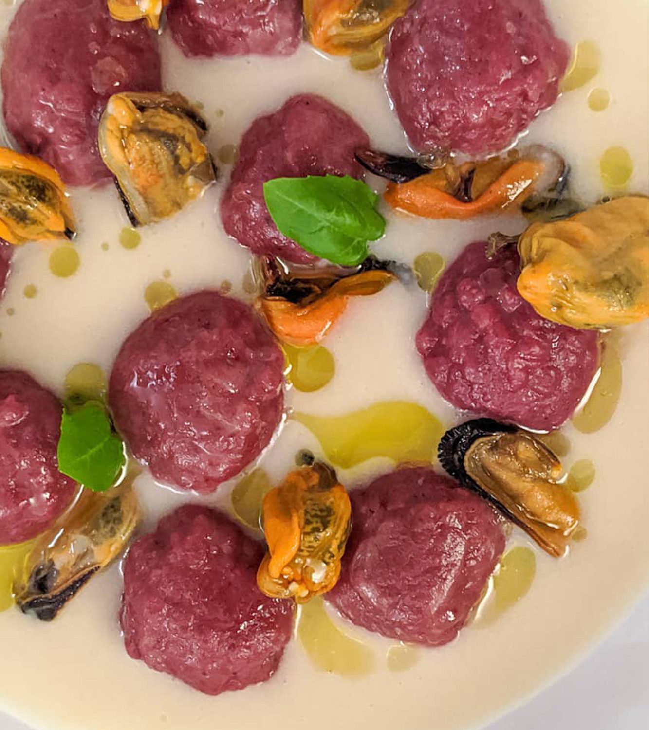 Potato gnocchi with beetroot, cannellini beans and mussels