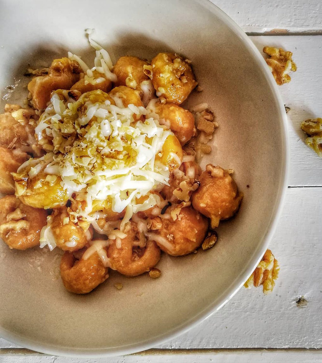 Potato gnocchi with pumpkin, with Asiago cheese and walnuts