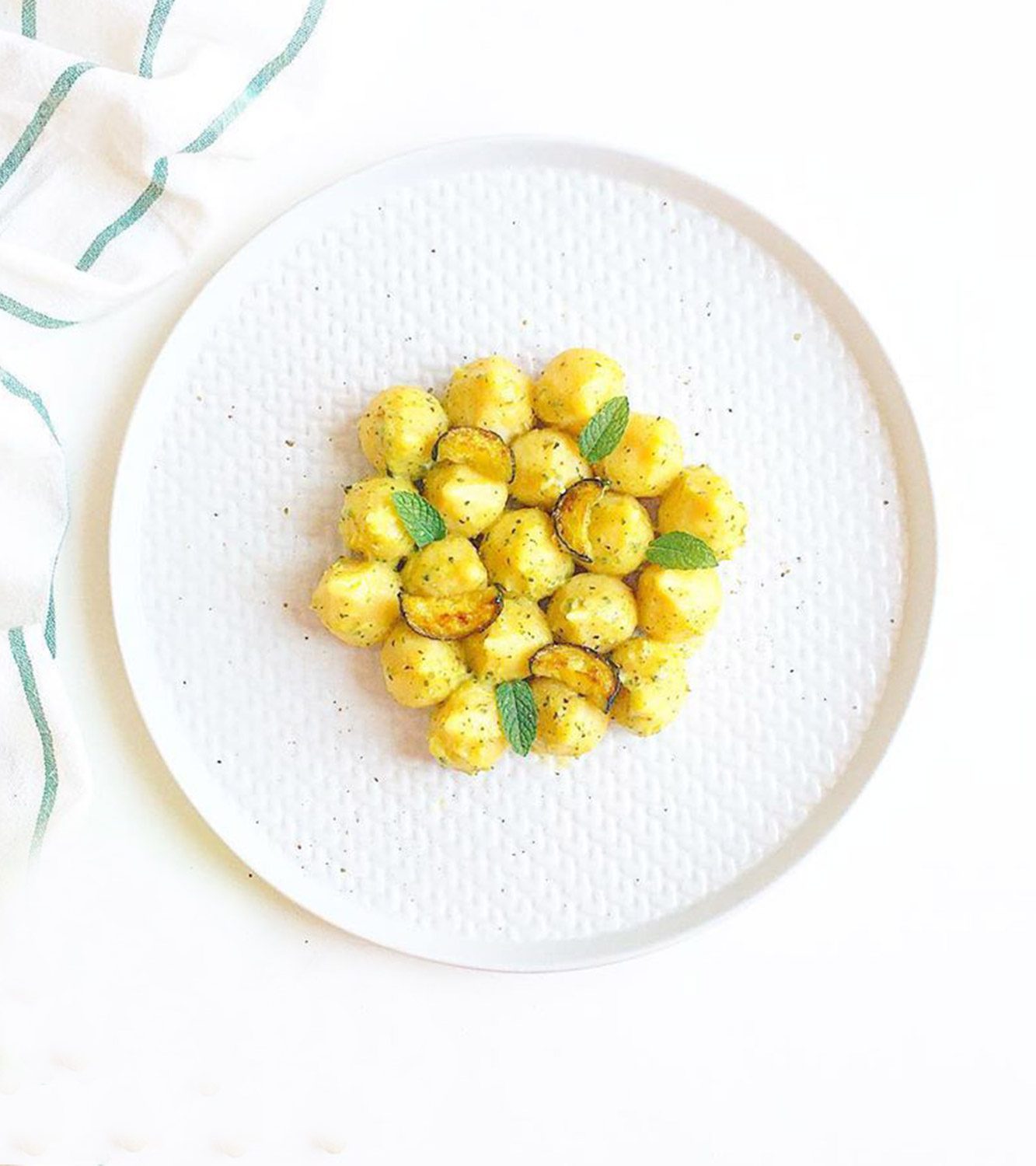 Potato gnocchi stuffed with tomato and mozzarella with zucchini and mint velouté