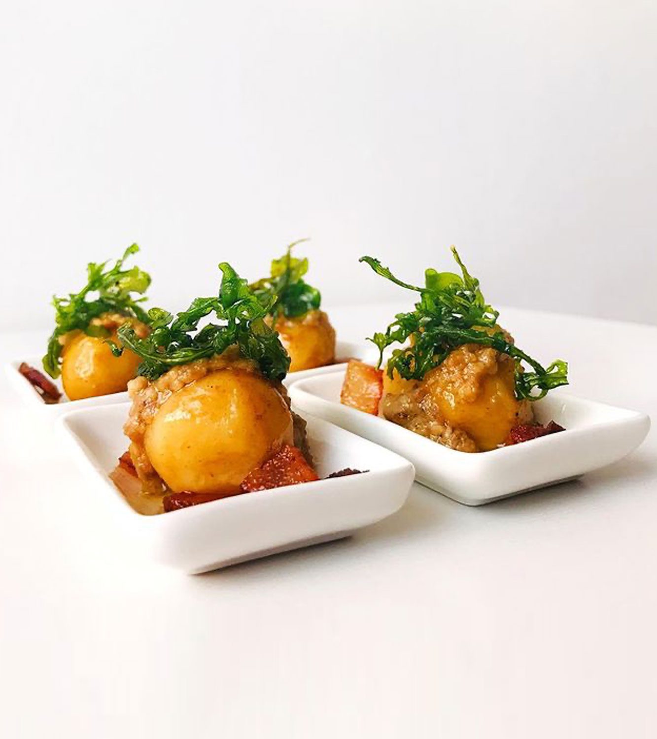 Gnocchi filled with Gorgonzola cheese, with guanciale, walnut pesto and fried arugula