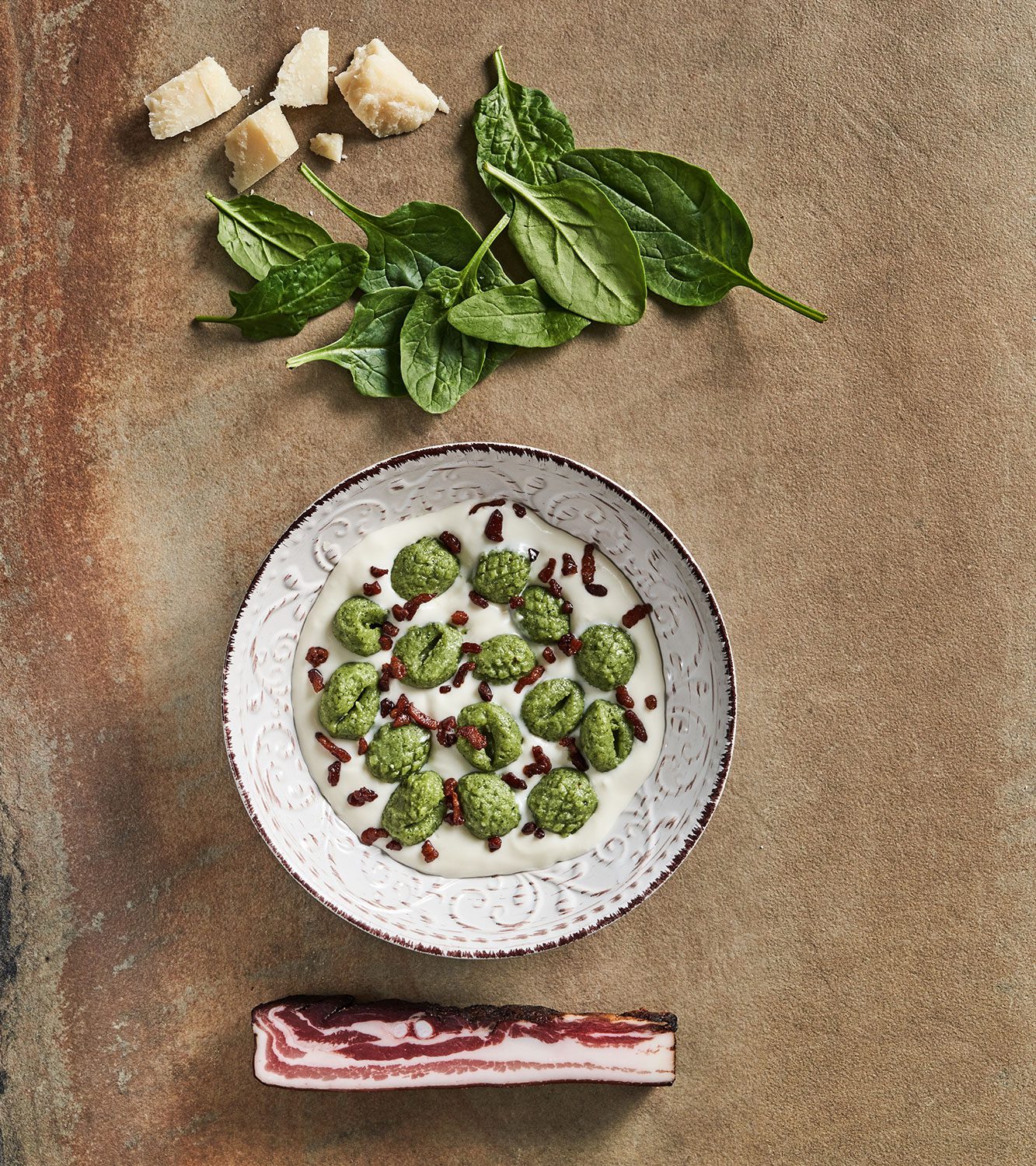 Gnocchi ricotta and spinach gnocchi with parmesan cream and crispy bacon