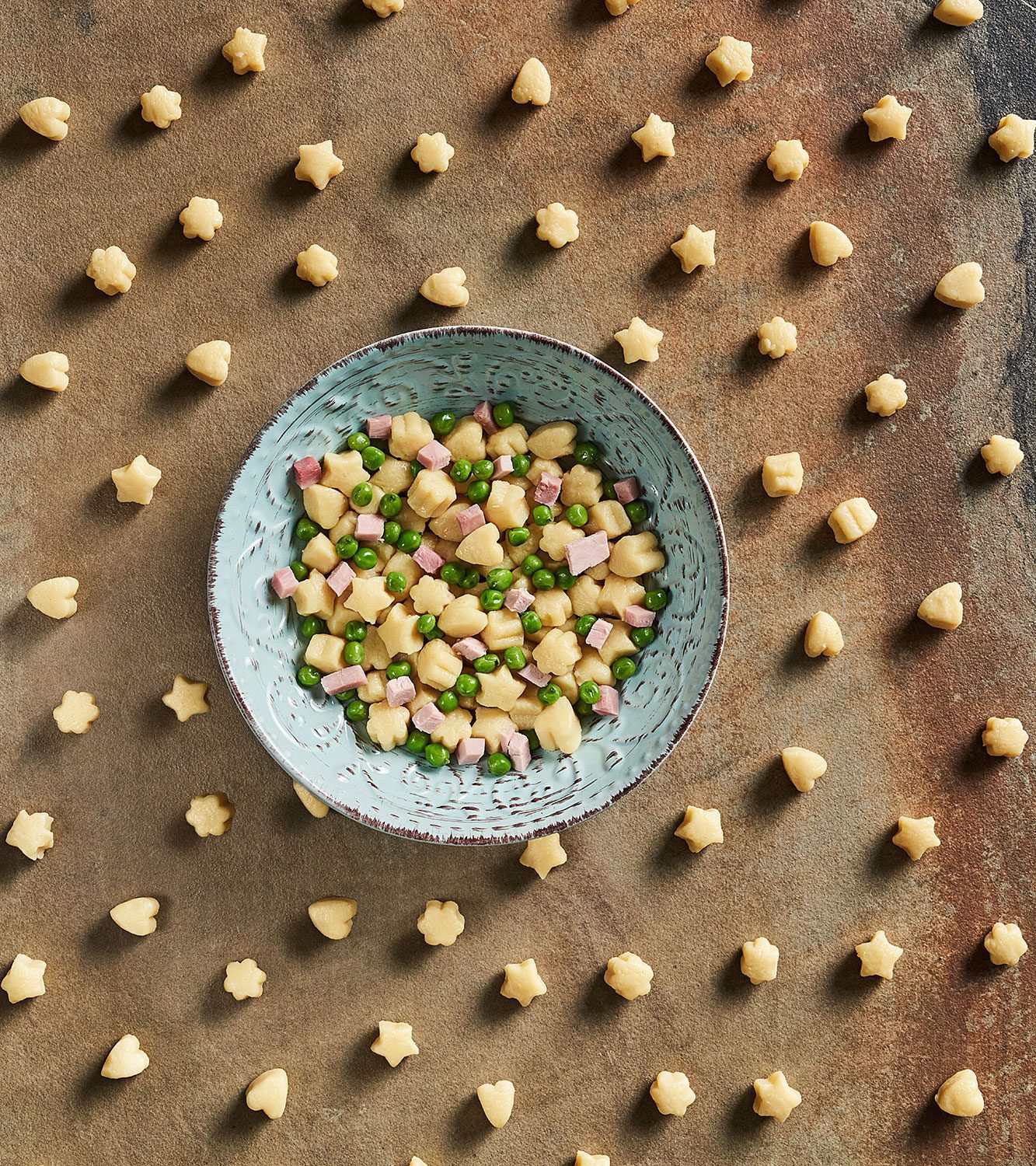 Fun shapes Happy potato gnocchi with peas and ham